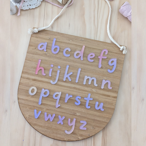 Handcrafted Pastel Alphabet Learning Plaque made from acrylic and bamboo for children's playroom or classroom decor.